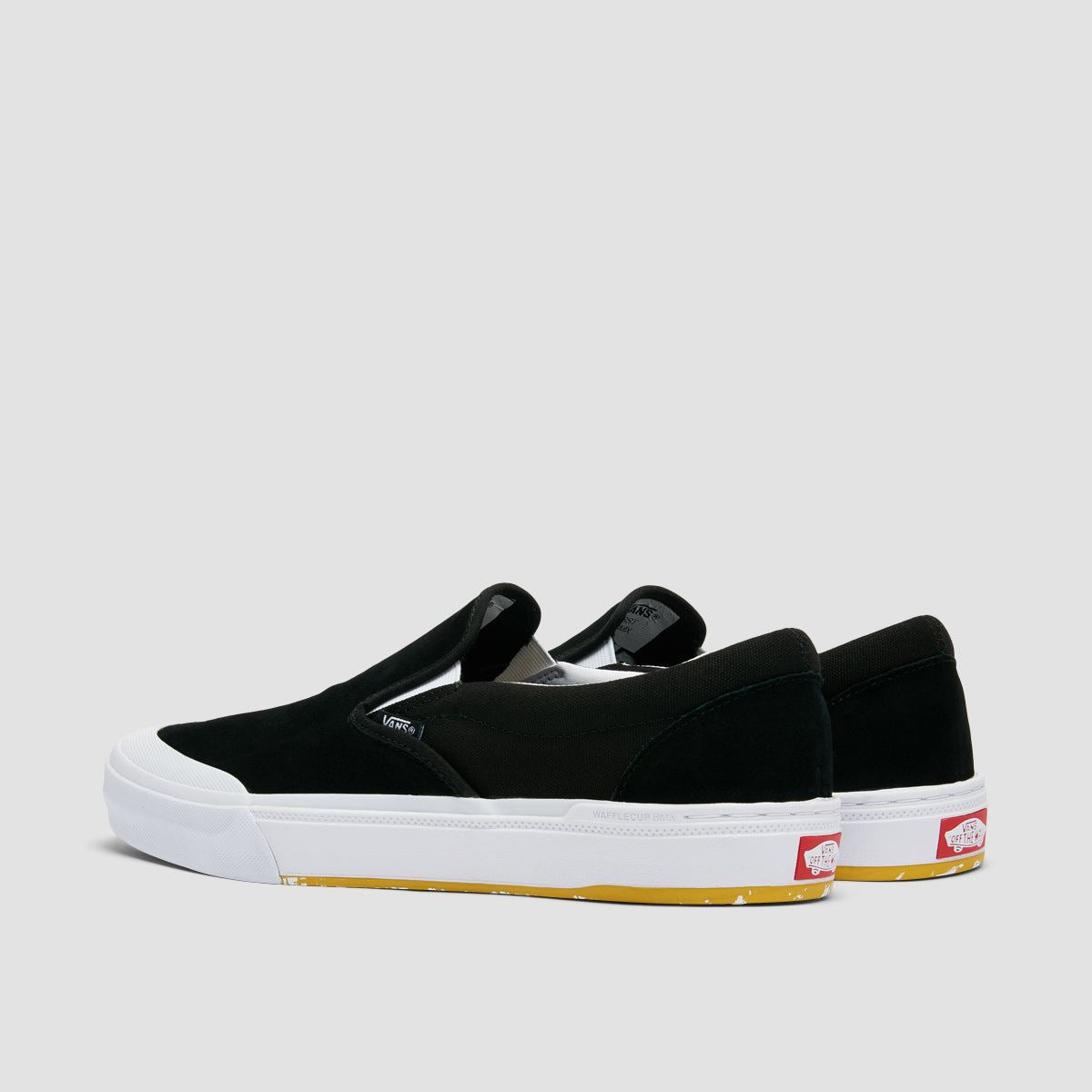 Black and yellow vans slip ons hotsell